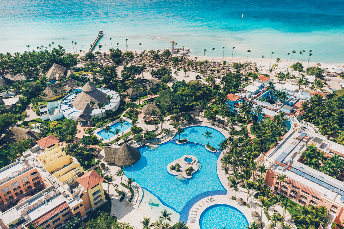 Iberostar Hacienda Dominicus all-inclusive resort with colonial-style architecture and beachfront pools in Bayahibe.