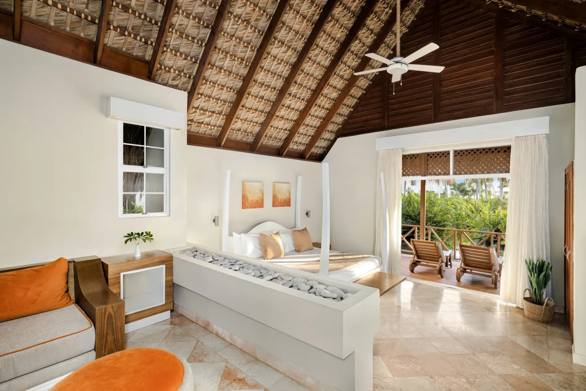 Sun Club Honeymoon Villa Tropical View with king canopy bed, vaulted thatched ceiling, and private terrace at Sunscape Dominicus La Romana.