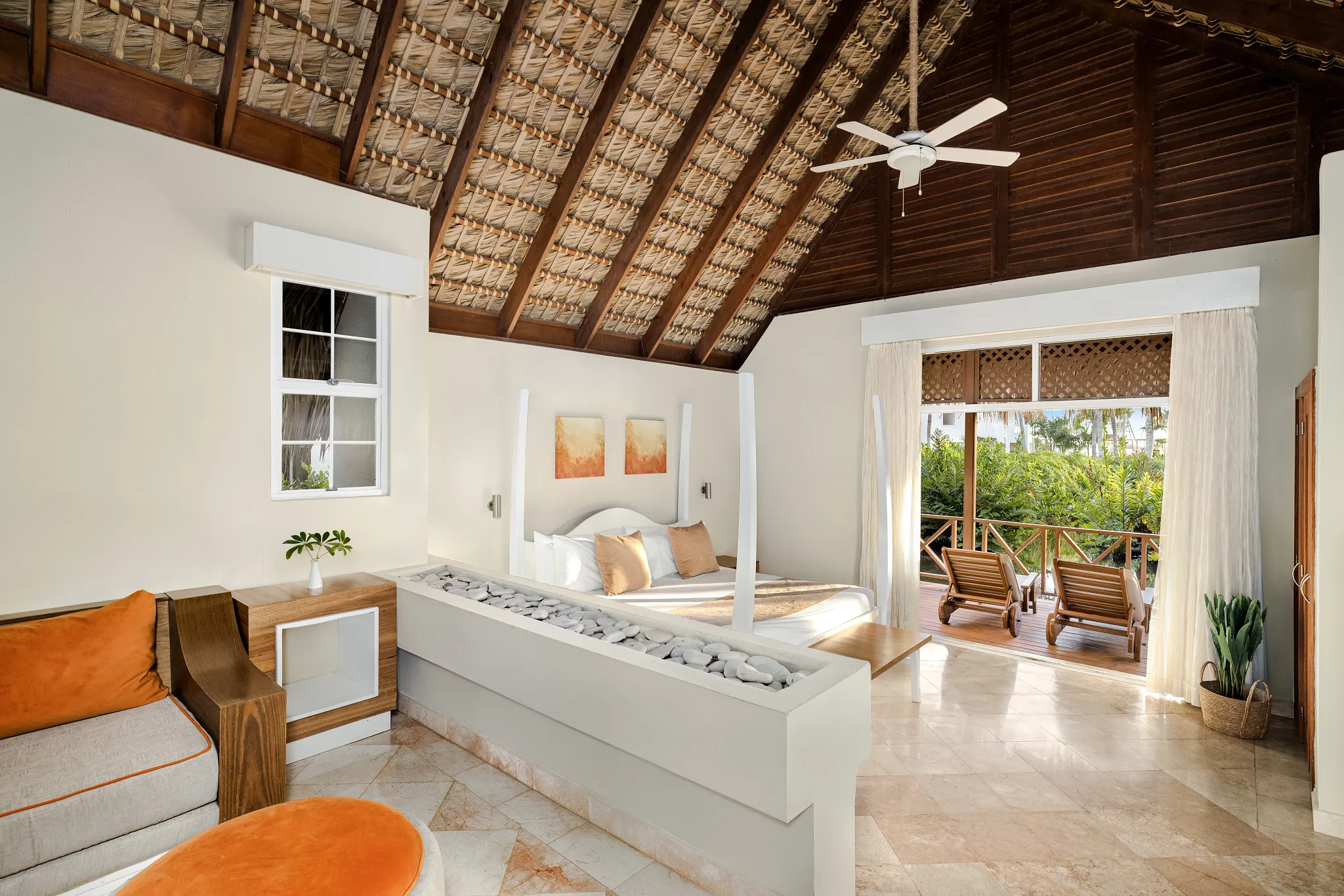 Sun Club Honeymoon Villa Tropical View with king canopy bed, vaulted thatched ceiling, and private terrace at Sunscape Dominicus La Romana.