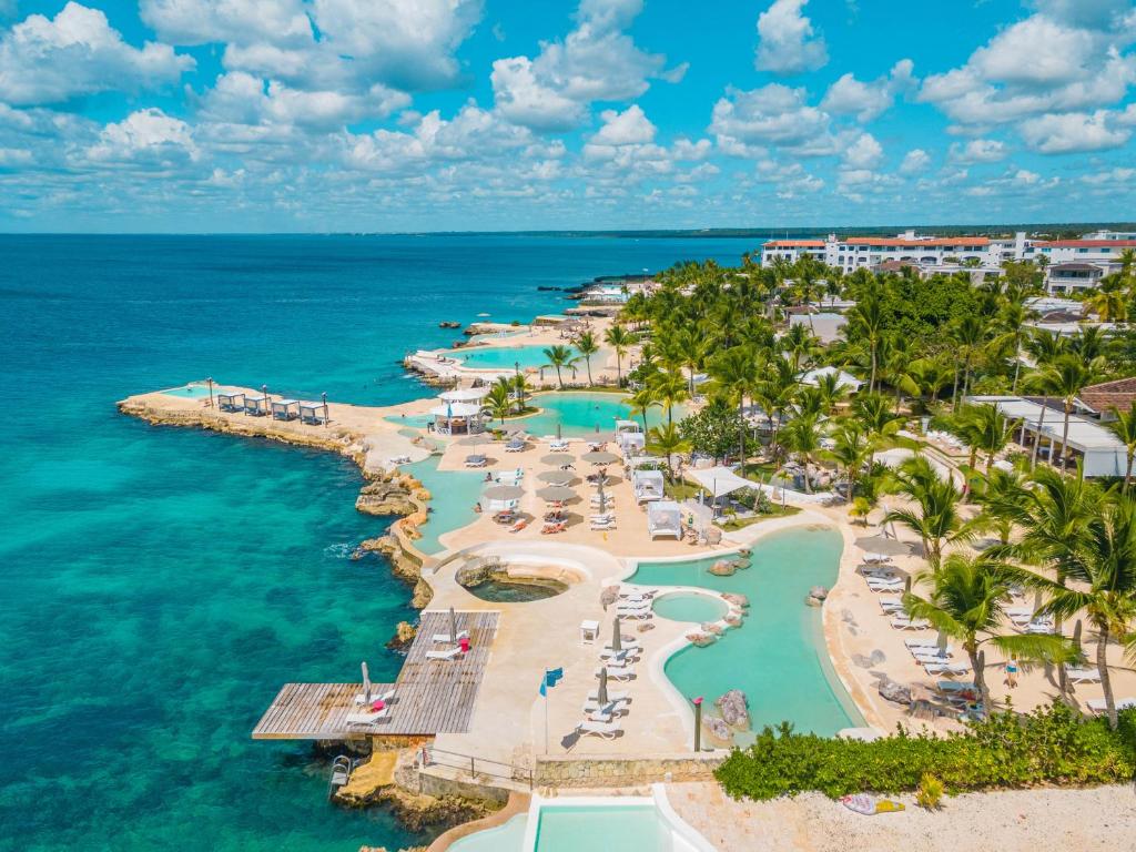 Tracadero Beach Resort oceanfront property with infinity pools and luxury condos in Bayahibe, Dominican Republic.